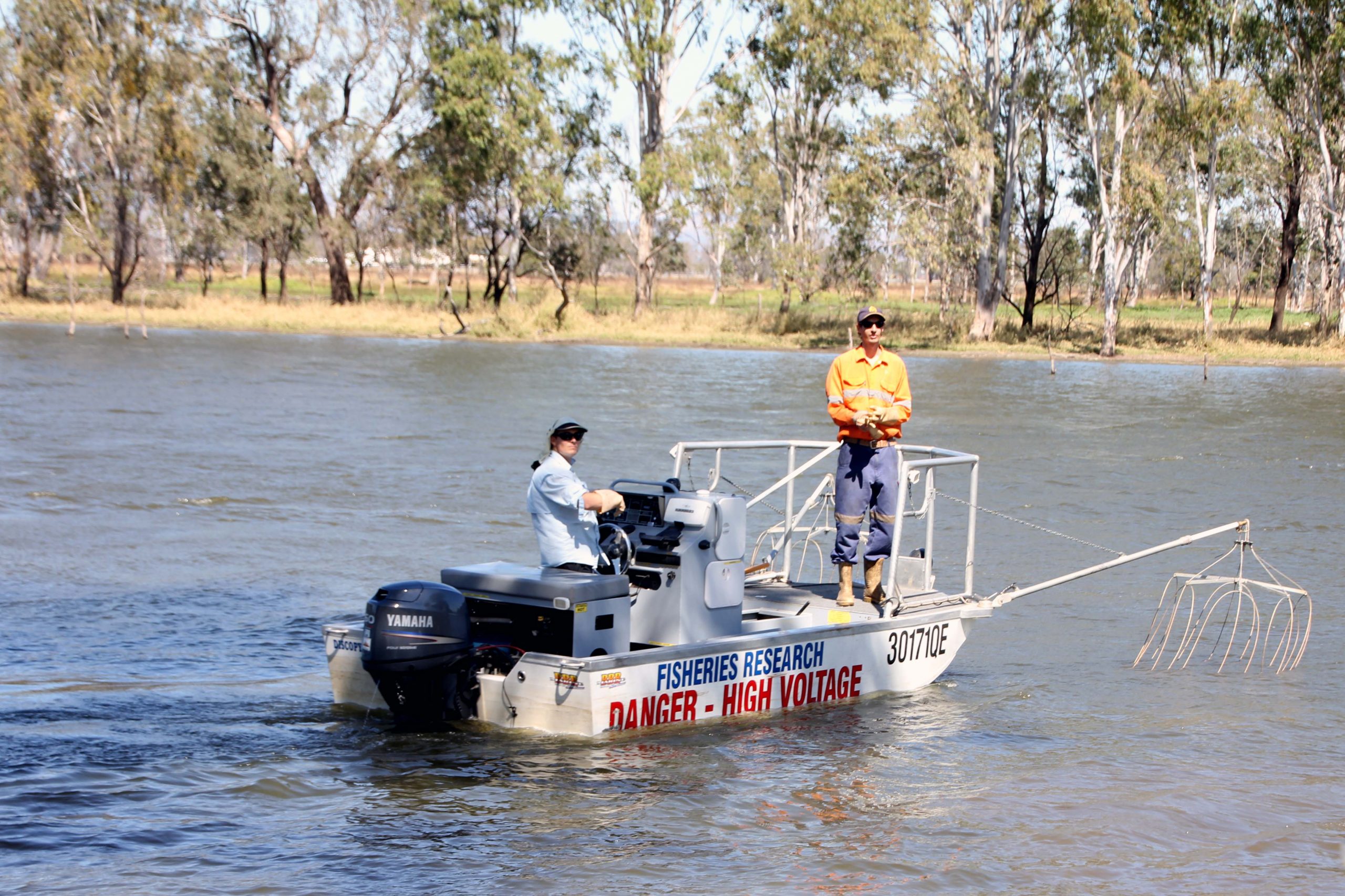 Men in electrofishing boat.