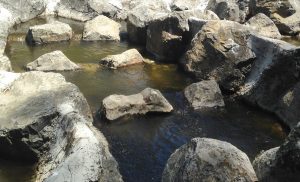 Rock ramp fish way pool and ridge.