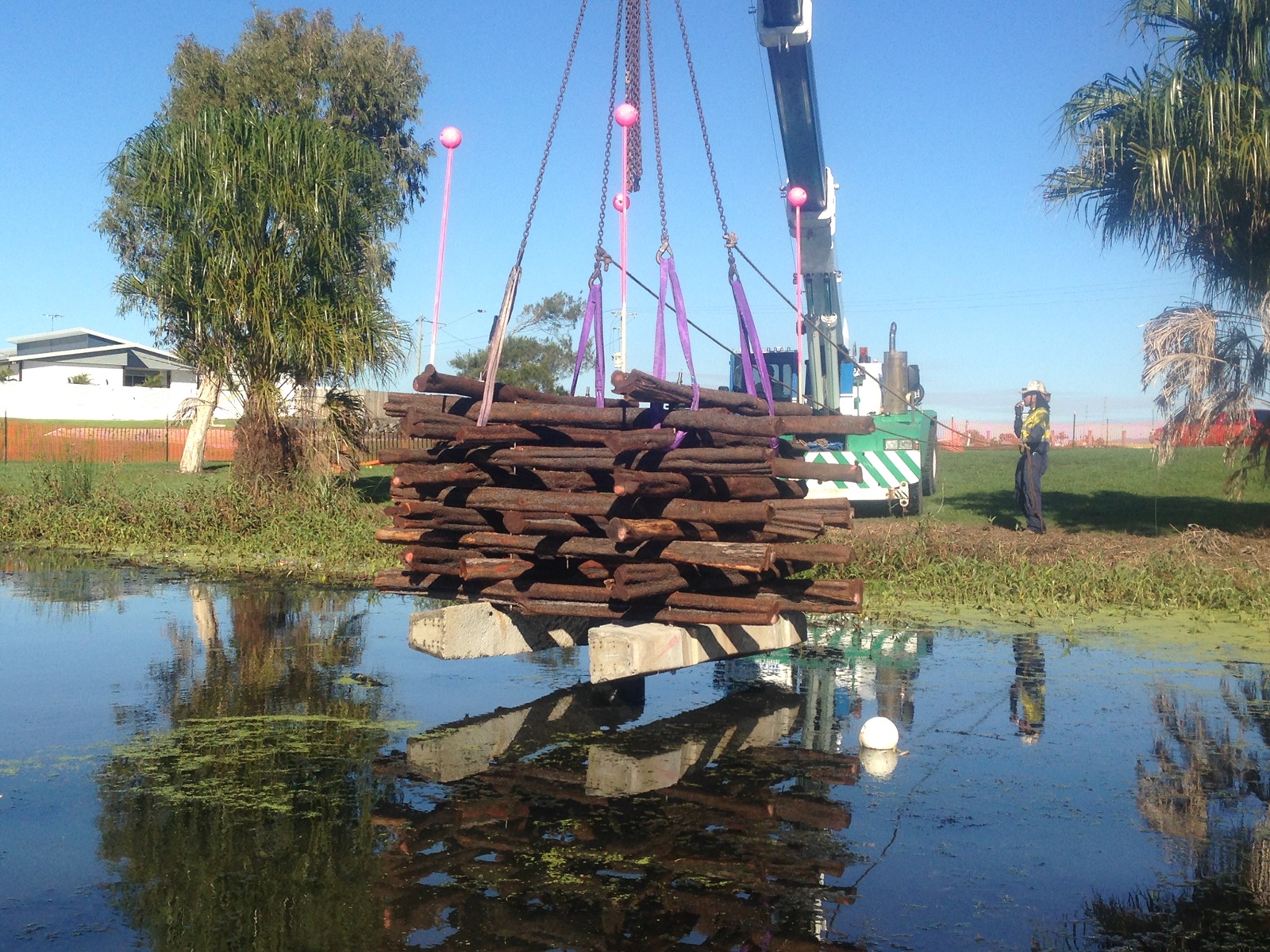 Crane depositing fish hotel at the Gooseponds.