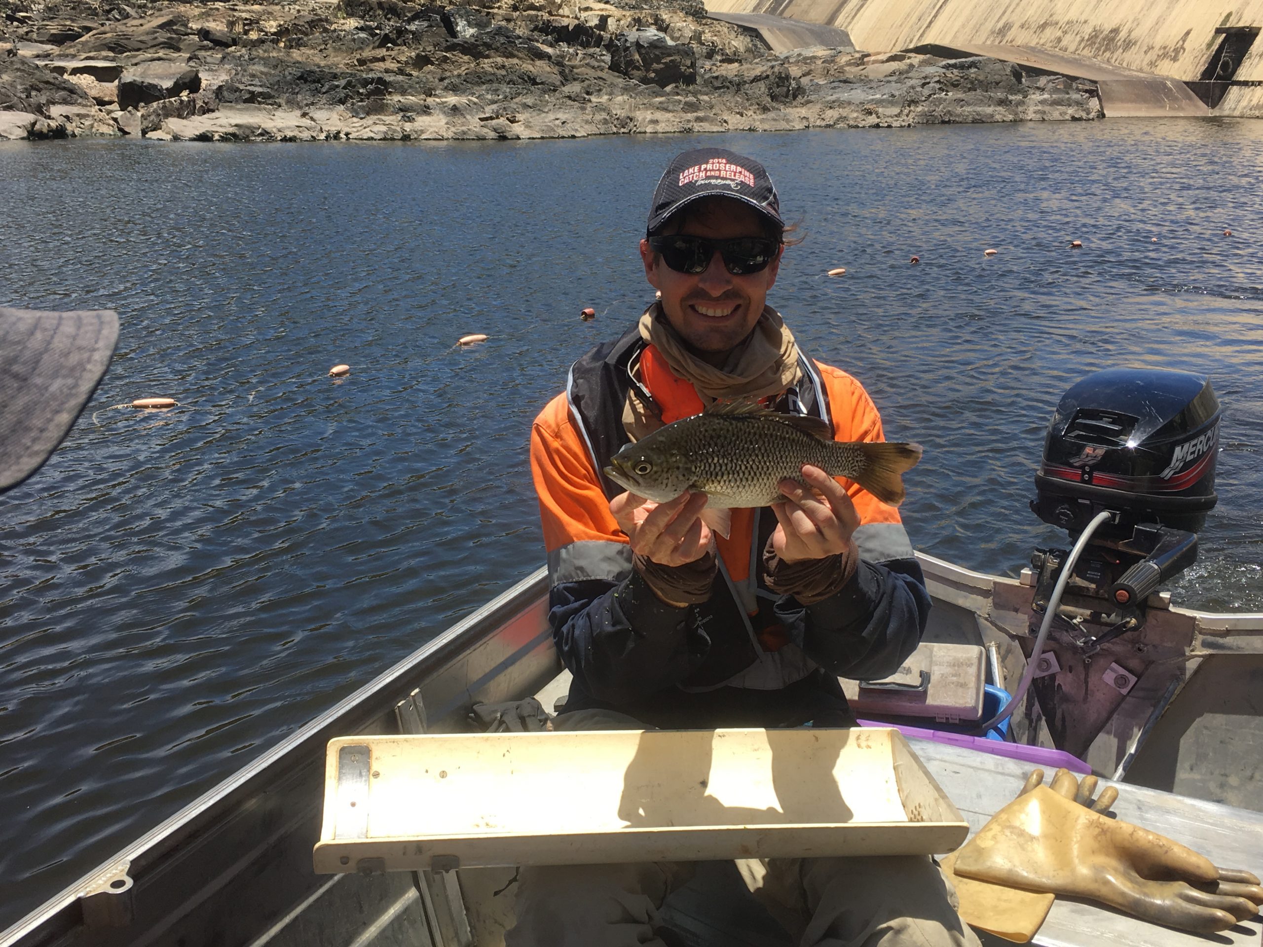 Man on boat holding Jungle perch.