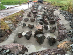 Rock-ramp fish ladder concreted in place by CS Environmental, showing control heights of ridges set to precise heights to maintain consistent drops between fishway pools.